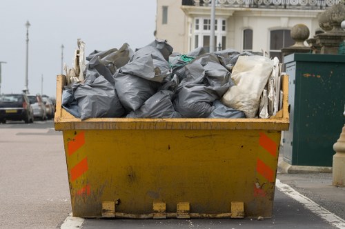 Workers segregating demolition waste for recycling